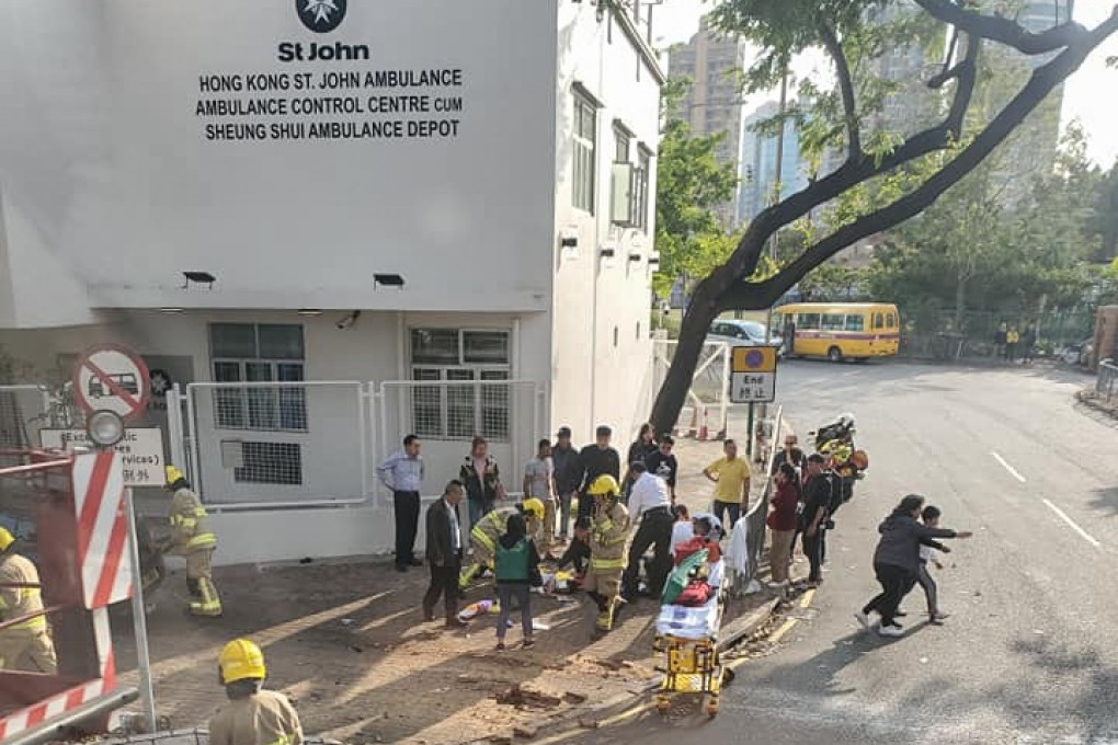 Firefighters treat the injured at the scene of the crash in Sheung Shui. Photo: Handout