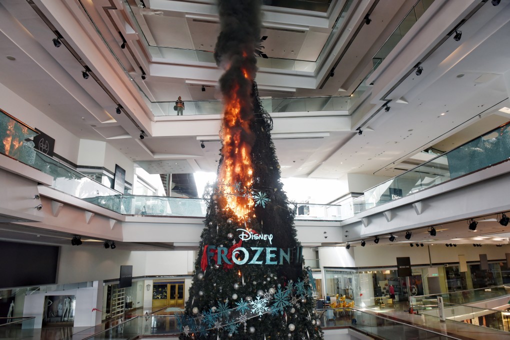 A Christmas tree set on fire by vandals during an anti-government protest at the Festival Walk shopping centre in Hong Kong’s Kowloon Tong on 13 November 2019. Photo: EPA-EFE