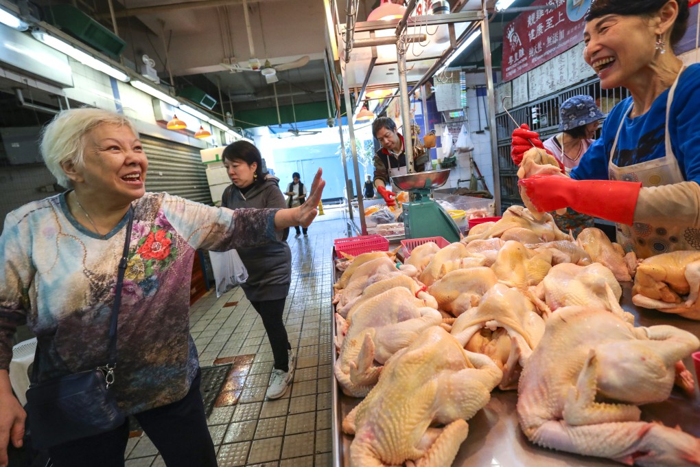 Having a laugh at the Kowloon City wet market last December. Hong Kong’s rankings in the World Happiness Report have fallen from 46th when the report was first published in 2012. Photo: May Tse