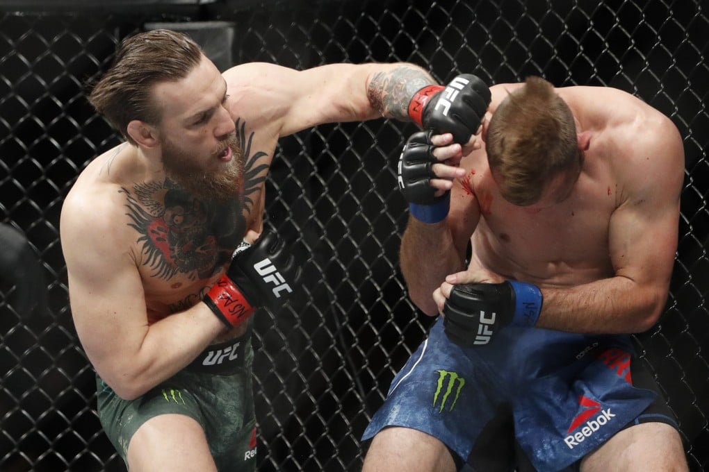 Conor McGregor hits Donald "Cowboy" Cerrone during their UFC 246 main event bout in Las Vegas. Photo: AP