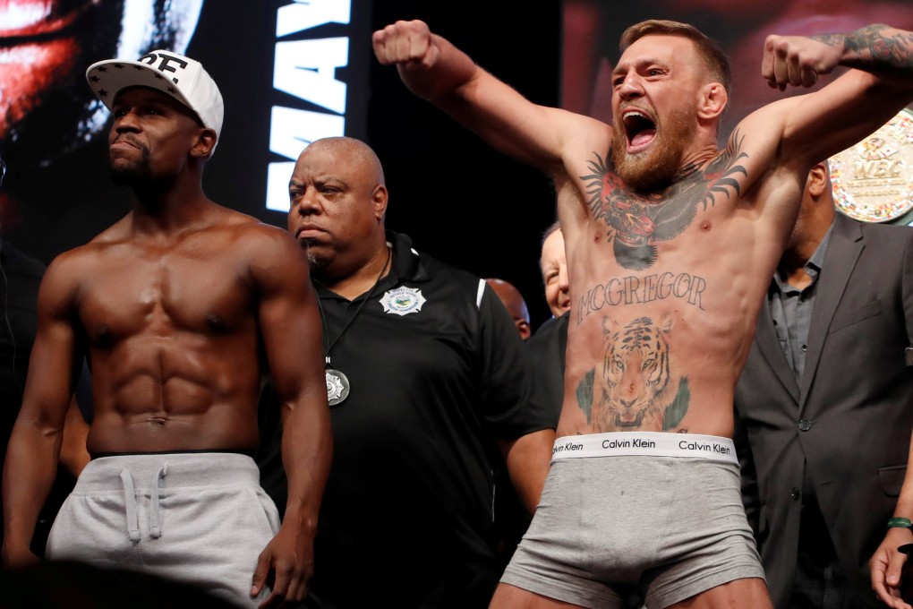 Conor McGregor (right) poses with Floyd Mayweahter before the official weigh-in of their record-breaking boxing superfight in 2017. Photo: Reuters
