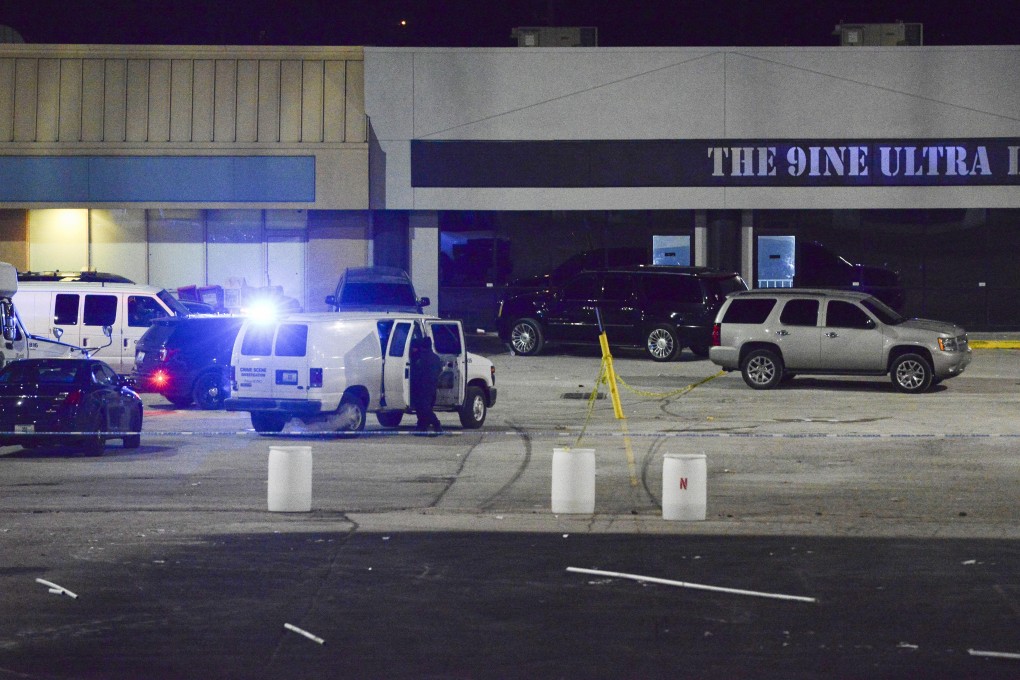 Police crime scene investigators gather evidence at the scene of a shooting at the nightclub. Photo: The Kansas City Star via AP