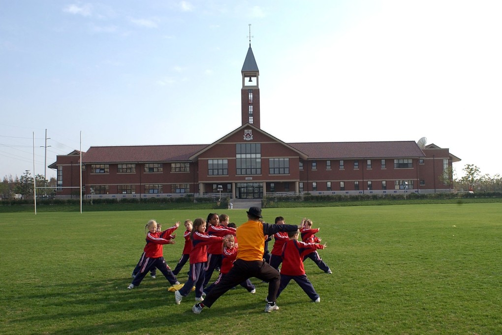 Pupils on the sports field at the Pudong campus of the Dulwich College in Shanghai on 30 December 2004. Photo: Handout.