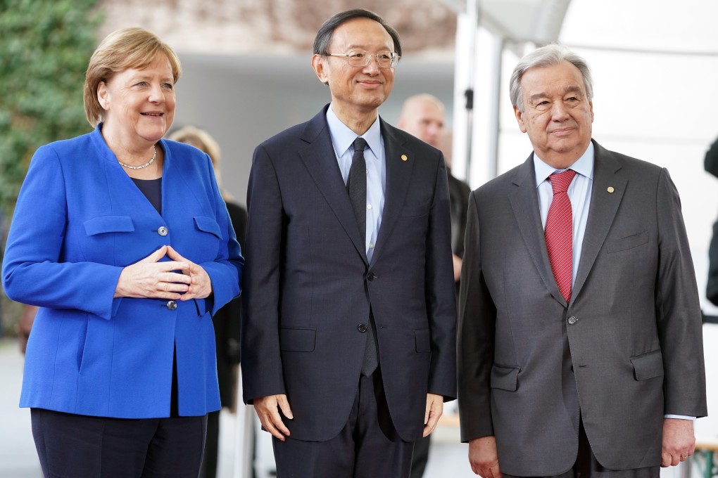 Yang Jiechi (centre) joins leaders including German Chancellor Angela Merkel and UN Secretary General Antonio Guterres at a conference on Libya in Berlin on Sunday. Photo: DPA