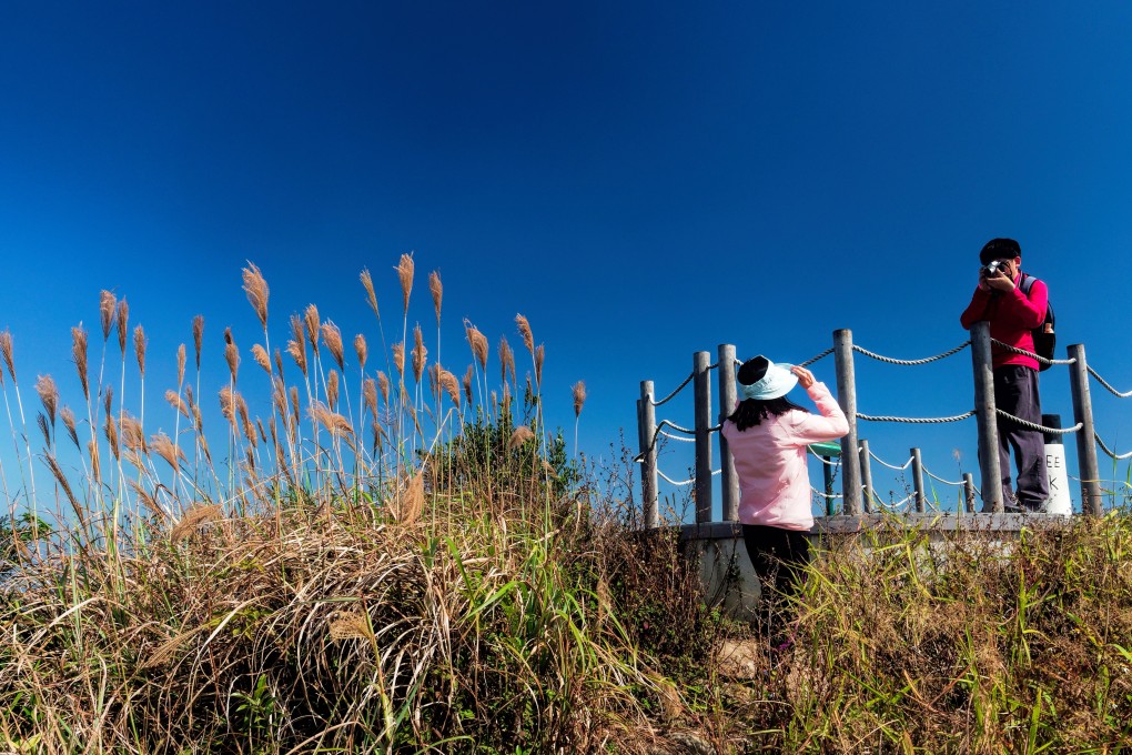 A couple take a photo at the summit of High West on Hong Kong Island. With tourist numbers down because of the protests, this is an ideal time to explore some of Hong Kong’s attractions. Photo: Martin Williams