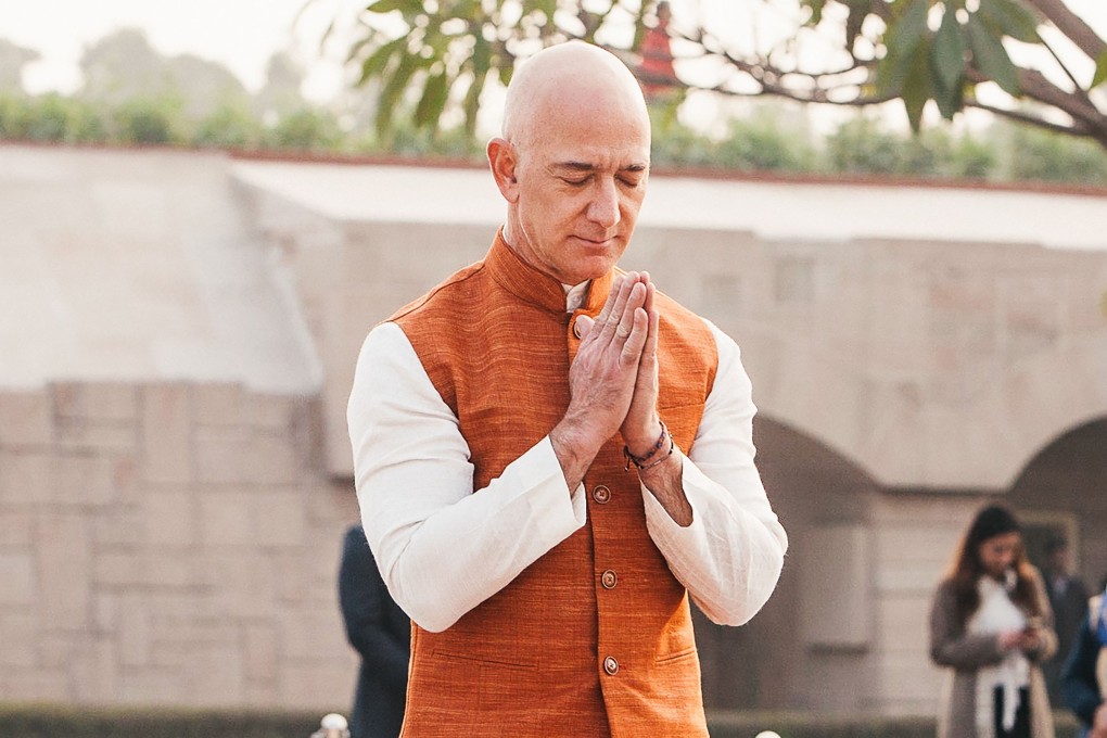 Jeff Bezos, the founder and president of e-commerce giant Amazon, pays his respects at the Mahatma Gandhi Memorial in New Delhi on January 14. Photo: Handout/Amazon/AFP