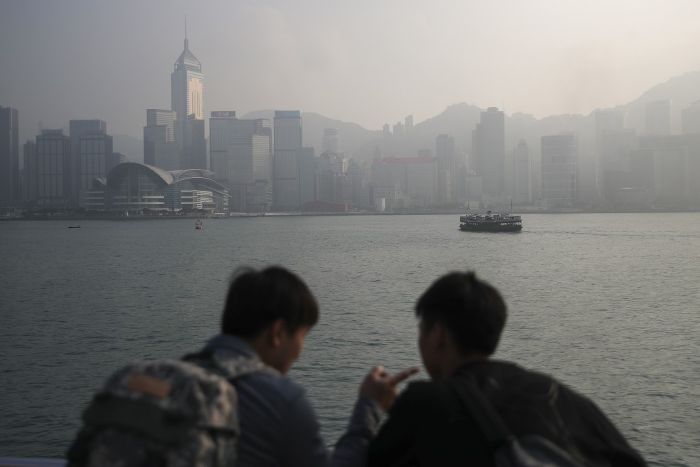 Haze covers the Victoria Harbour skyline on December 22, 2019. Photo: Winson Wong