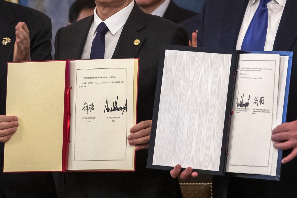Chinese Vice-Premier Liu He and US President Donald Trump sign an initial trade deal on January 15 at the White House in Washington. Photo: EPA-EFE