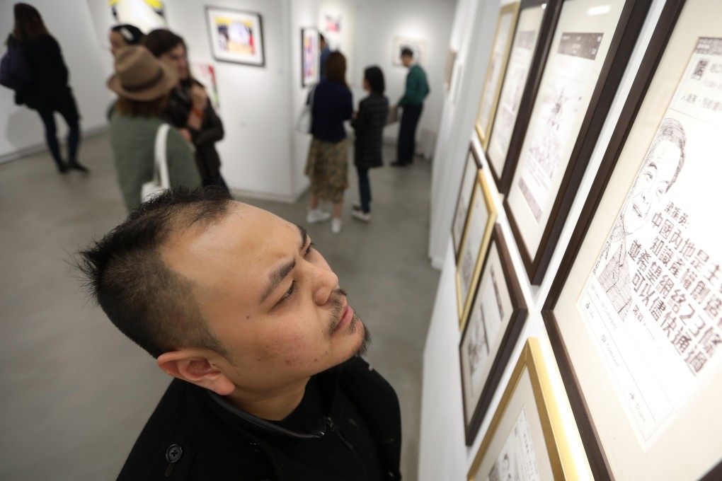 Artist Chow Chun-fai with one of his works at the opening of the ‘What's On Paper’ exhibition, at Hong Kong Visual Arts Centre, in December. Photo: Xiaomei Chen