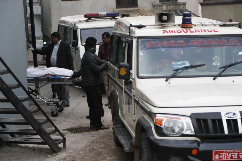 Hospital staff load bodies of Indian tourists into an ambulance for postmortem, at a hospital in Kathmandu, Nepal. Photo: AP Photo