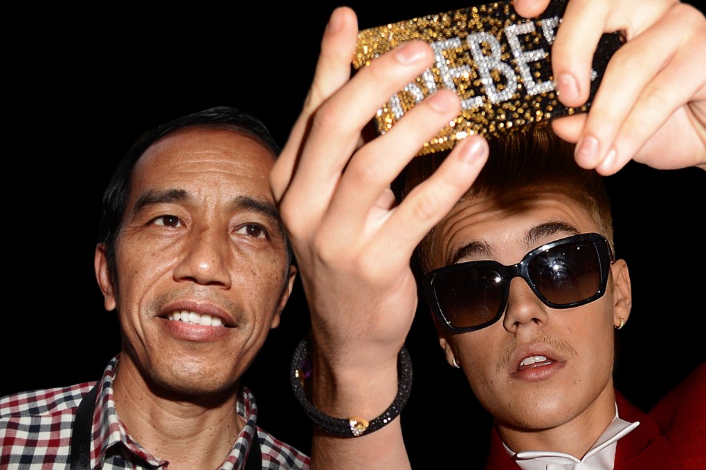 Indonesian President Joko Widodo and singer Justin Bieber do a selfie on one of Agan Harahap’s photos. Photo: courtesy of Agan Harahap