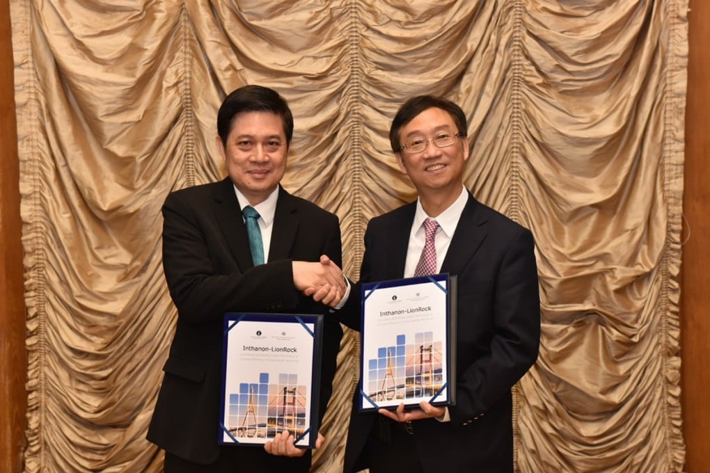 Edmond Lau (right), senior executive director of Hong Kong Monetary Authority and Mathee Supapongse, deputy governor of the Bank of Thailand, release a joint research report on the application of the central bank digital currencies in cross-border payments, on Wednesday. Photo: SCMP