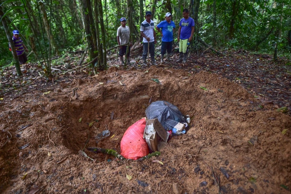 A mass grave where the bodies of a pregnant woman, five of her children and a sixth minor were killed in a religious sacrifice. Photo: AFP