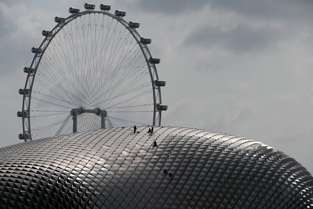 Workers conduct maintenance checks on the roof of the Esplanade theatre in Singapore on January 13. Photo: AFP