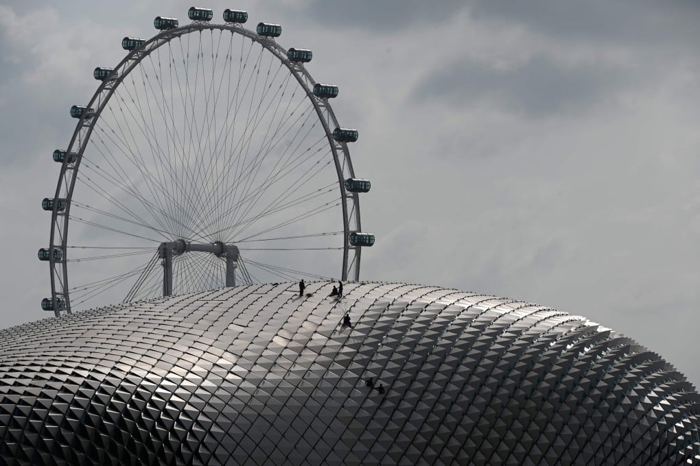 Workers conduct maintenance checks on the roof of the Esplanade theatre in Singapore on January 13. Photo: AFP