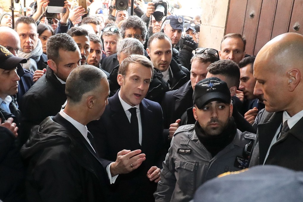 The incident occurred during a spat between Israeli forces and Emmanuel Macron’s own security detail as he entered the Church of St Anne. Photo: AFP