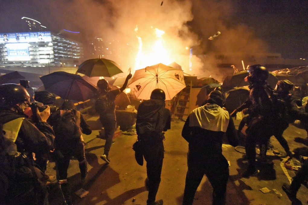Young protesters throw petrol bombs at police outside the Hong Kong Polytechnic University in Kowloon in November 2019. No one thought the protests sparked in June by an extradition bill would go on so long, says Jeff Wasserstrom, author of a book about recent events in Hong Kong. Photo: Kyodo