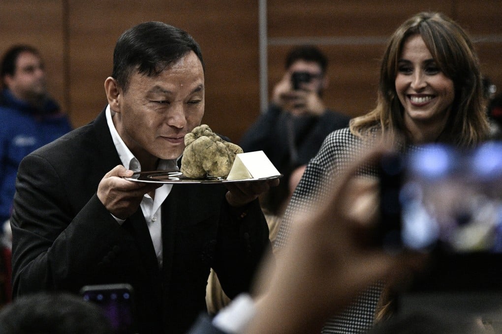 A Chinese buyer smelling a white truffle he bought at the 19th Alba White Truffle World Auction in November 2018. Photo: AFP