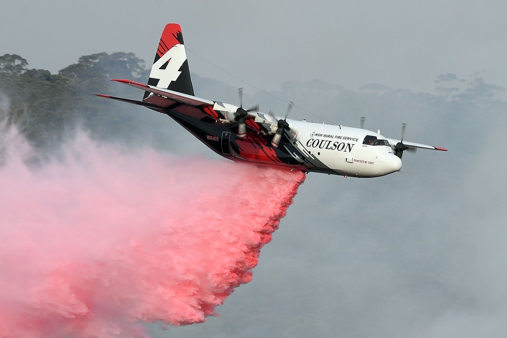 A C-130 Hercules plane drops fire retardant in Penrose, New South Wales state. Photo: AFP