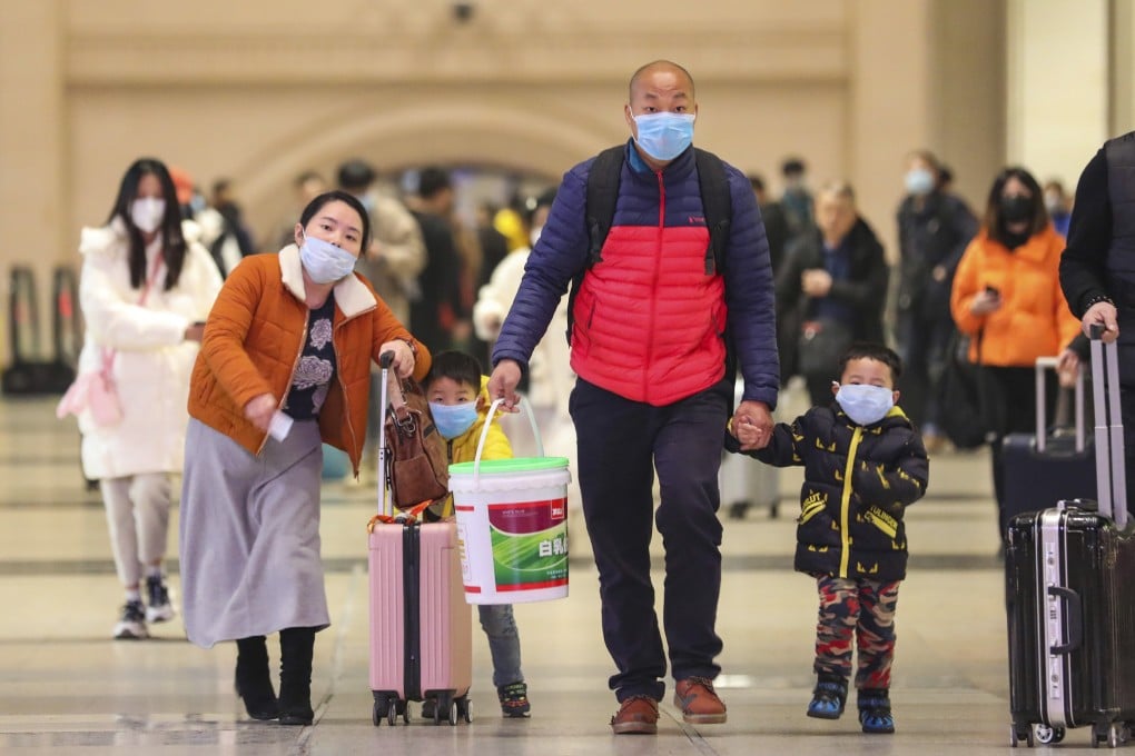 Travellers at Hankou Railway Station in Wuhan on January 21, 2020. The city’s airport and rail station are packed as travellers desperately try to get out of city at the epicentre of the outbreak. Photo: AP