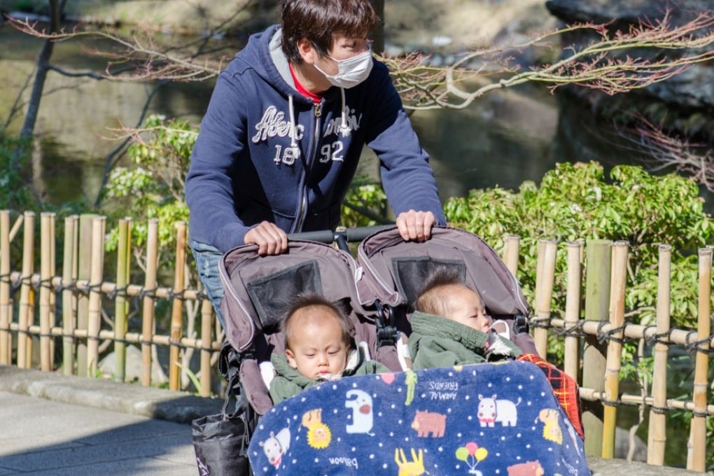 Japanese government data indicates the more time a husband spends on housework and childcare on days off, the more likely his wife is to have another child. Photo: Shutterstock