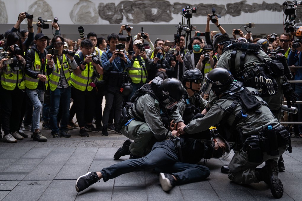 Riot police detain a protester outside Chater Garden during a rally on January 19. Photo: SOPA Images via ZUMA Wire/dpa