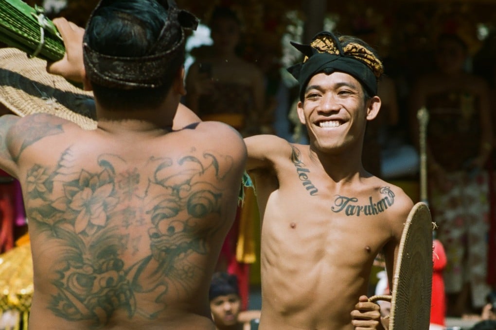 Two members of Bali’s indigenous Bali Aga tribe take part in the pandan wars, or Makare-kare, a series of ritual duels that honour Batara Indra, the Vedic god of war. The traditional combat, part of a harvest festival, has begun drawing tourists. Photo: Daniel Darmawan