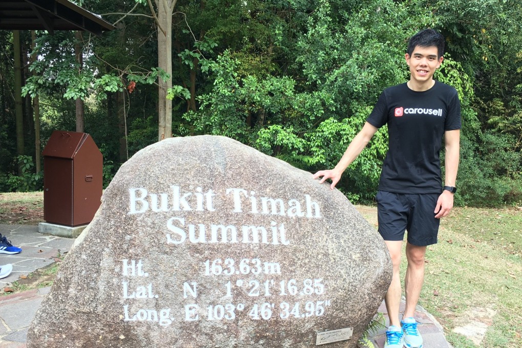 Carousell CEO Quek Siu Rui at the summit of Singapore's Bukit Timah Hill. Photo: SCMP/Zen Soo