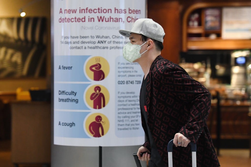 A man wearing a face mask arrives at Heathrow Airport in London on Friday. Photo: EPA-EFE