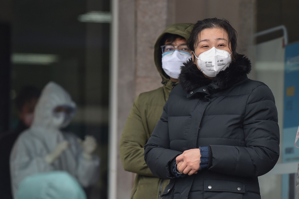 People wearing protective face masks to help stop the spread of a deadly virus which began in the city of Wuhan, China. Photo: AFP