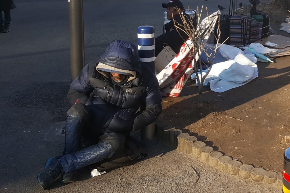 Homeless people seen around Seoul Station Plaza. Photo: David Lee