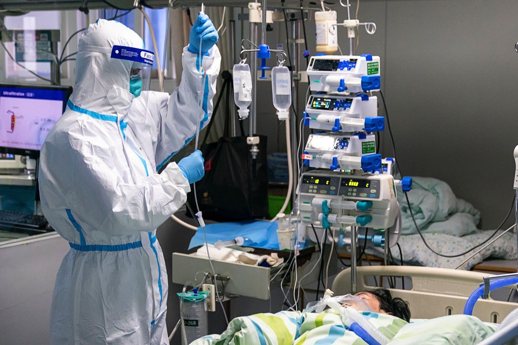 A medical worker checking the drip of a patient in the Intensive Care Unit (ICU) of Zhongnan Hospital in Wuhan, Hubei Province. Photo: EPA-EFE/XINHUA