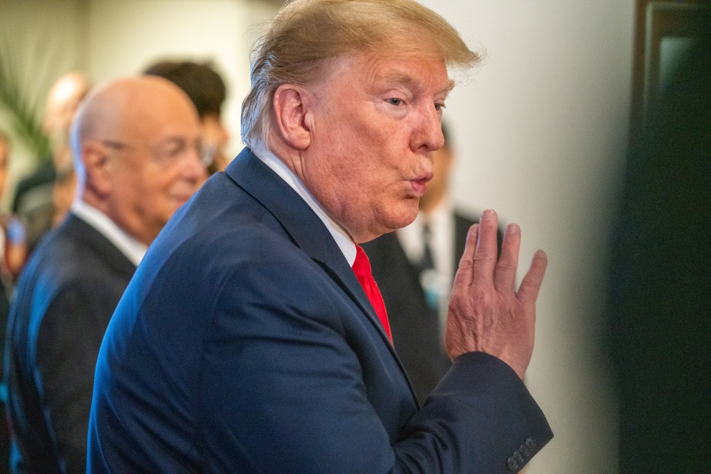 US President Donald Trump gestures as he arrives at the 50th World Economic Forum annual meeting. Photo: dpa