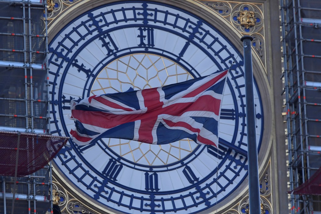 A face of the Big Ben clock tower is seen a day before New Year celebrations. Photo: Reuters