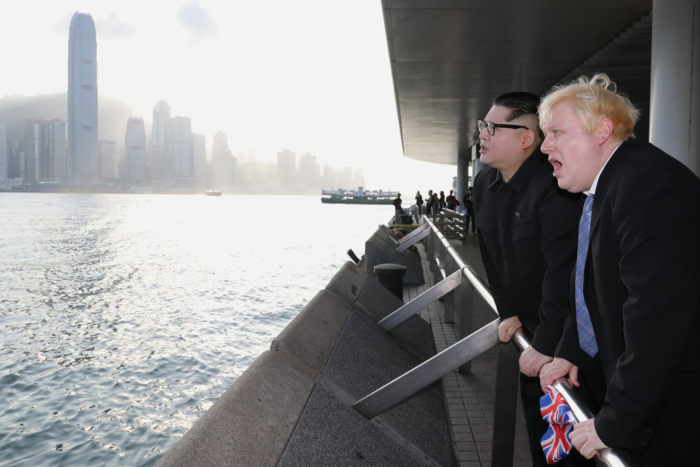 Boris Johnson performer Drew Galdron takes the Star Ferry in Hong Kong with Kim Jong-un impersonator Howard X. “The real Boris isn’t prepared to say anything in favour of the pro-democracy movement in Hong Kong. So I’m here to show my support and my solidarity,” he said. Photo: Dickson Lee