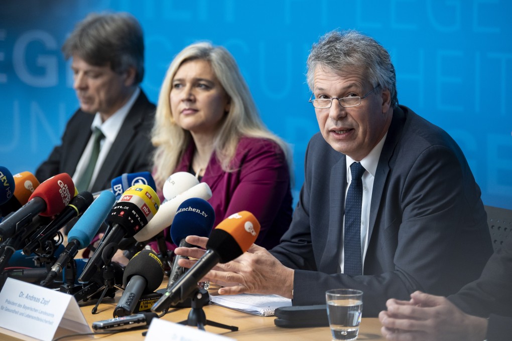 President of the Bavarian state office for health and food safety, Andreas Zapf (third left) and Bavarian Health Minister Melanie Huml (centre) speak during a news conference to confirm a German case of coronavirus. Photo: EPA-EFE