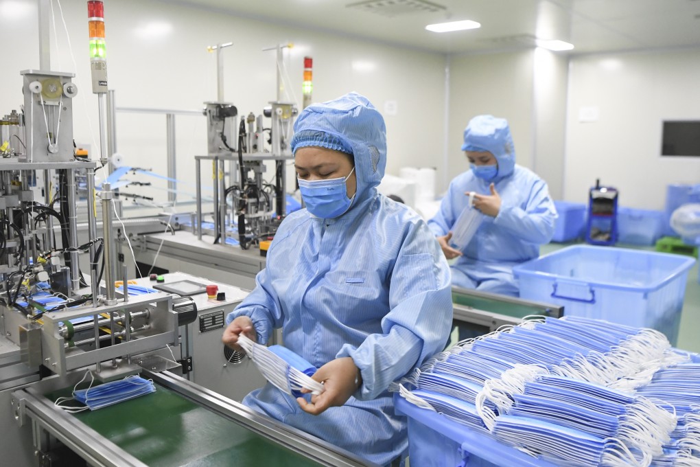 Staff work at a medical supplies firm in Chongqing on Monday. Some factories have continued production over the Lunar New Year holiday. Photo: Xinhua