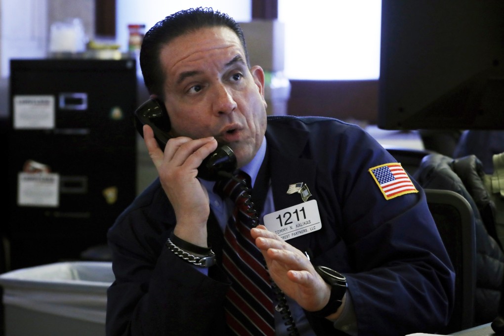 Trader Tommy Kalikas works on the floor of the New York Stock Exchange on Monday. Photo: AP