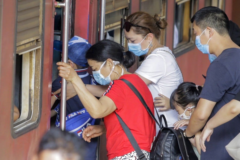 Chinese tourists wear protective masks at a railway station in Colombo, Sri Lanka, on Monday. Photo: EPA-EFE