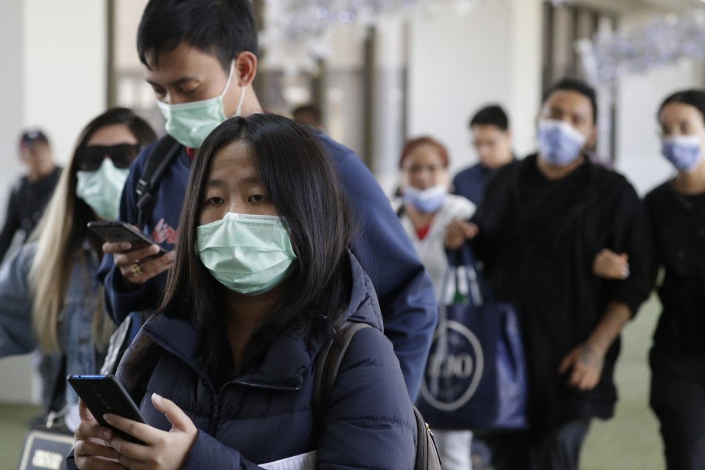 Passengers arrive at Manila’s international airport. Photo: AP