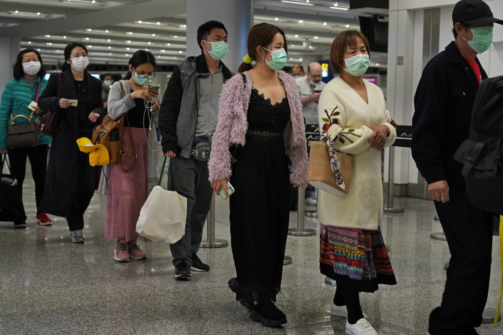 Masked passengers at Hong Kong International Airport. Photo: AP