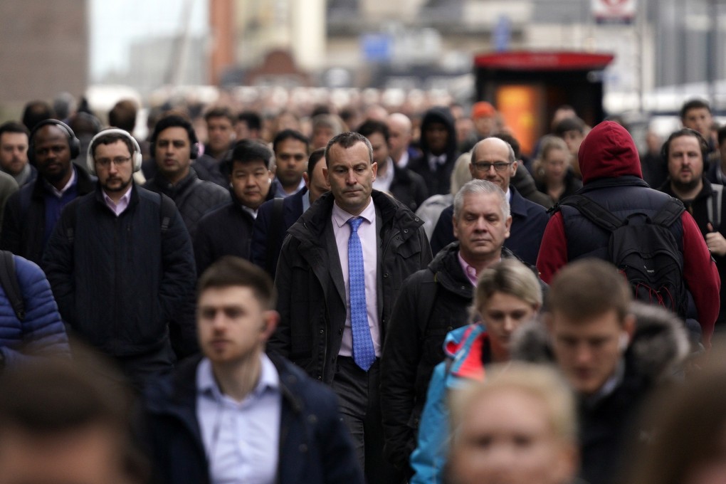 Commuters cross London Bridge into the City of London financial district on January 27. The IMF says the world economy grew by just 2.9 per cent last year, taking growth uncomfortably close to the widely accepted global recession threshold of approximately 2.5 per cent. Photo: EPA-EFE