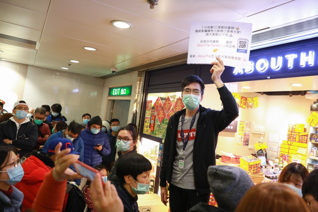A crowd throngs an outlet for masks at Kornhill Plaza in Taikoo Shing. Photo: May Tse