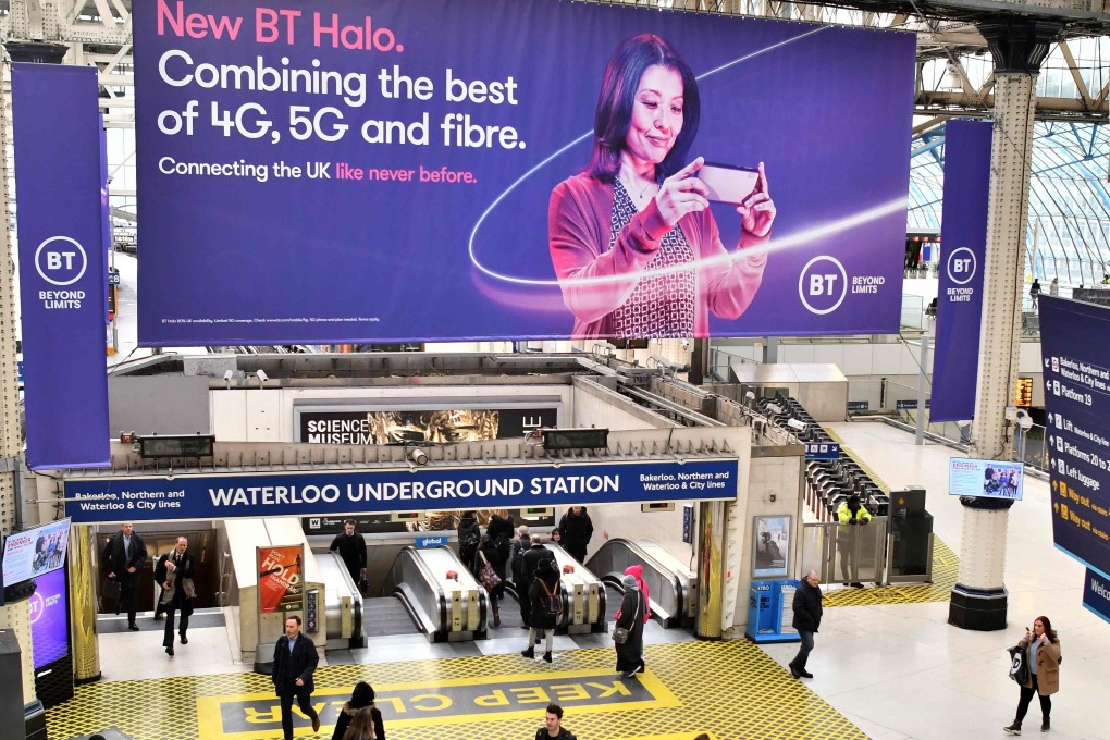 A billboard advertising mobile telecommunication is displayed at the Waterloo underground station in London on Tuesday. Chinese tech firm Huawei has been designated a “high-risk vendor” but will be allowed to build some elements of Britain’s 5G network. Photo: AFP