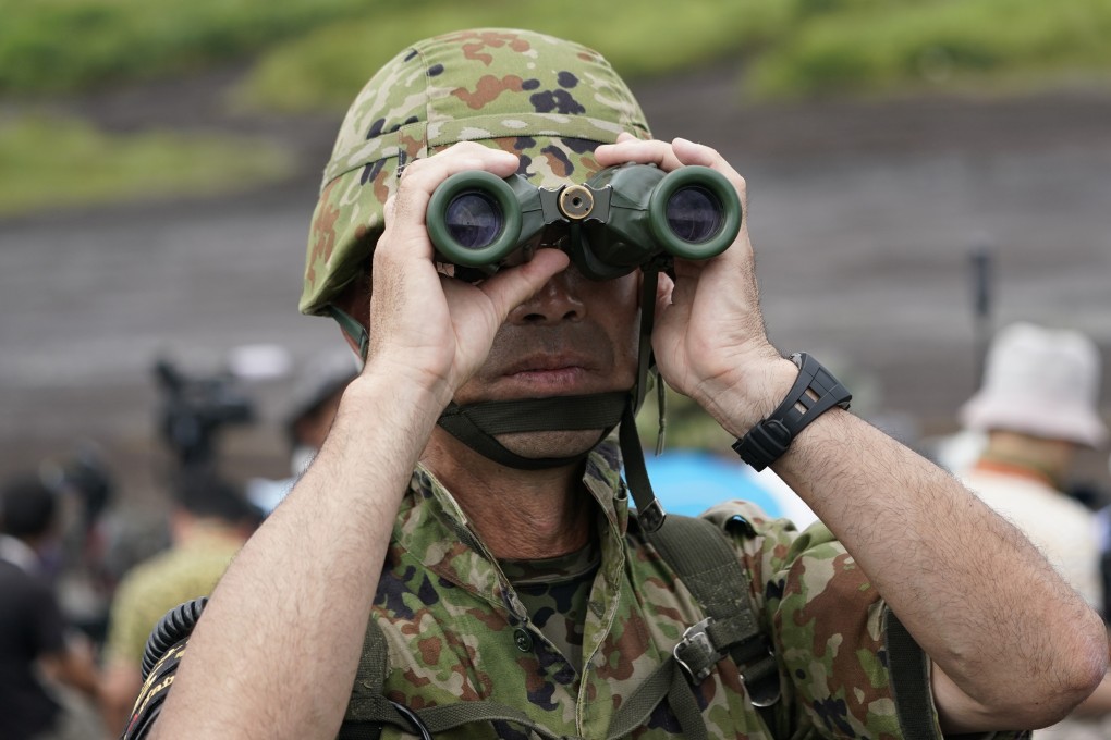 A Japanese soldier uses a pair of binoculars during a live fire exercise in Shizuoka Prefecture. File photo: Bloomberg