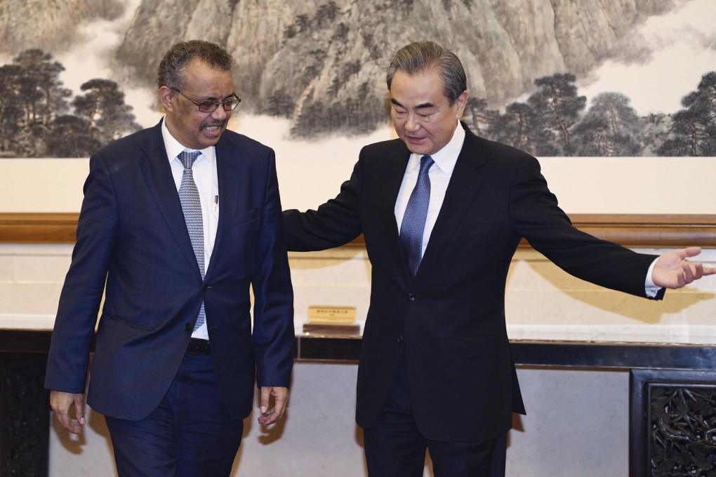 World Health Organisation director general Tedros Adhanom Ghebreyesus (left) meets Chinese Foreign Minister Wang Yi in Beijing on Tuesday to discuss how to curb the spread of a new coronavirus. Photo: Kyodo