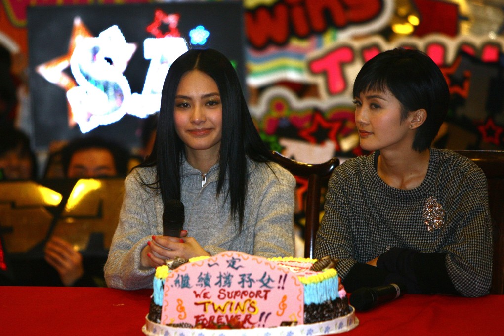 A sombre Gillian Chung (left) with fellow Twin Charlene Choi at a meeting with fans following the leak of nude photos of Chung in 2008, which led the duo to a temporary split. Chung turned 39 on January 21.