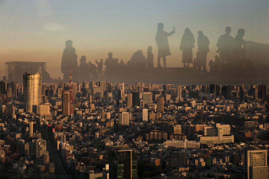 Visitors are reflected on the glass walls of Shibuya Sky observation deck in the Shibuya district of Tokyo. The city is likely to remain an investors’ darling as demand is expected to continue to outstrip supply, especially when it comes to offices. Photo: AP
