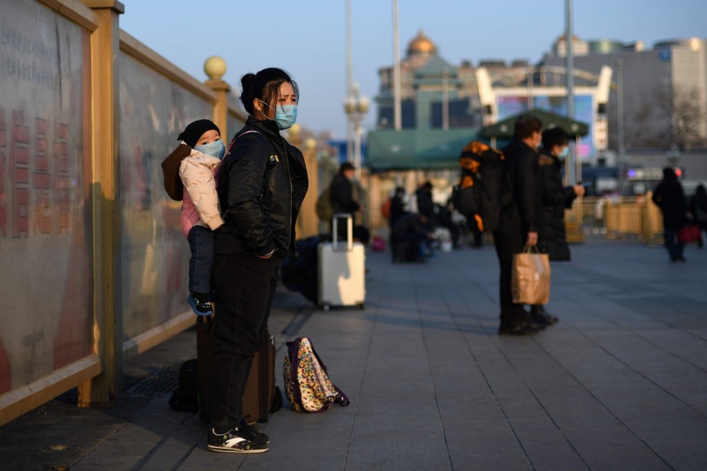 Passengers arriving at Beijing Railway Station on Thursday after the Lunar New Year holiday wear masks. The coronavirus outbreak is developing into China’s biggest health scare since the Sars epidemic in 2003. Photo: AP