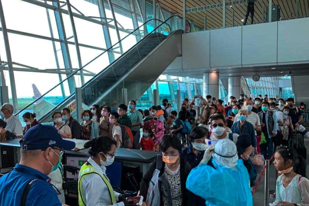 Wuhan residents are screened as they prepare to board their flight home at Kota Kinabalu International Airport in Malaysia on Friday evening. Photo: Handout
